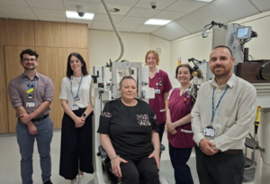 Patient Lydia Harrison (seated) with members of the team including Peter Corlett (right) and Laura Howard (second from left)