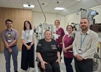 Patient Lydia Harrison (seated) with members of the team including Peter Corlett (right) and Laura Howard (second from left)